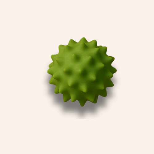 The spiky light green ball zoomed in on a pale blush pink background 